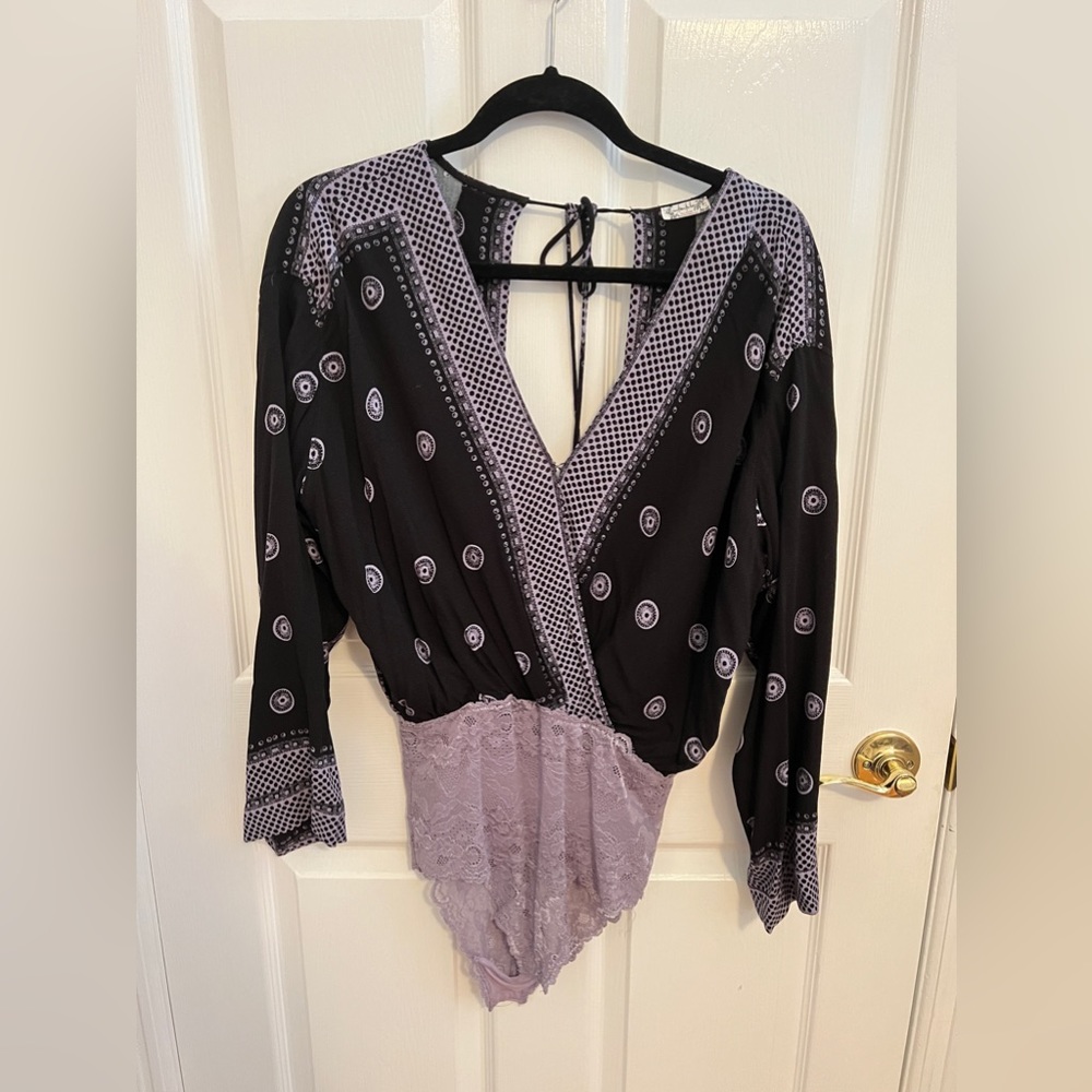 Free people body suit with an open back